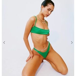 NWT With jean green 2 piece swimsuit with bag. Top size S, bottom size XS.